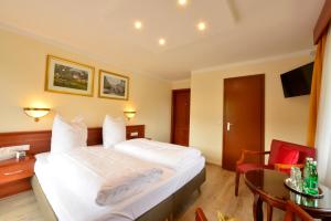 Ein Bett oder Betten in einem Zimmer der Unterkunft Hotel Beretta