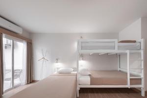 Postel nebo postele na pokoji v ubytování COROOM BKK