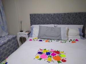 En eller flere senge i et værelse på El Alemán