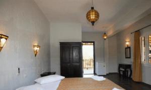A bed or beds in a room at To Ktima tis Matinas