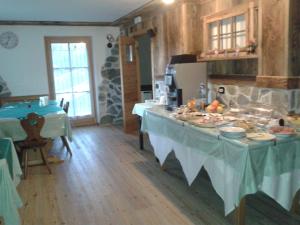 a kitchen with a table with food on it at B&B Mary in Peio