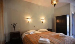 A bed or beds in a room at To Ktima tis Matinas
