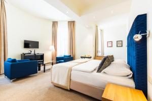Posteľ alebo postele v izbe v ubytovaní HiLight Suites Hotel