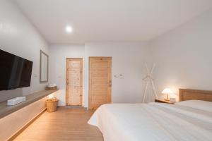 Postel nebo postele na pokoji v ubytování COROOM BKK