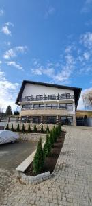 a large building with a lot of windows at Vale Humor Residence in Mănăstirea Humorului