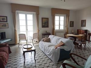 a living room with a couch and a table at Poggio dei sogni in Rapallo