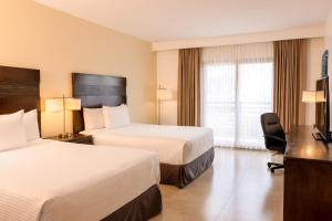 Postel nebo postele na pokoji v ubytování Wyndham Garden Cancun Downtown