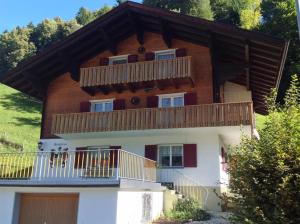 a large house with a balcony on top of it at Gästehaus Flöry in Schruns