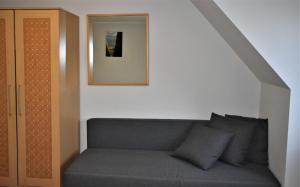 a living room with a couch and a mirror at Guest House Gero Vėjo Namai in Klaipėda +103 photos