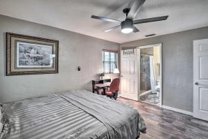 a bedroom with a bed and a ceiling fan at Deltona Lake House, Day Trip to Disney and Universal in Deltona