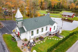 an aerial view of a house with a church at 13 Mi to Camelback Ski! Creekside Lincoln Lodge in Brodheadsville