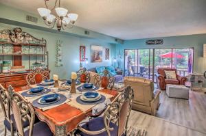 a dining room with a table and chairs at Coastal Escape with Balcony and Grill Less Than 2 Mi to Beach! in Myrtle Beach