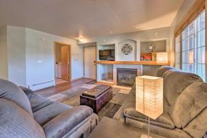 a living room with two couches and a fireplace at Steamboat Home with Garage, 1 Mi to Ski Resort in Steamboat Springs