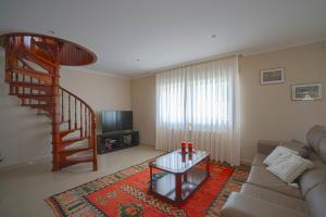 TV a/nebo společenská místnost v ubytování A Casa da Tía Babel