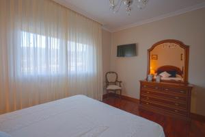 Postel nebo postele na pokoji v ubytování A Casa da Tía Babel