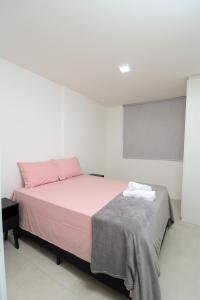 En eller flere senge i et værelse på Paraíso das águas, conforto e descanso com vista mar..