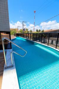 Swimmingpoolen hos eller tæt på Paraíso das águas, conforto e descanso com vista mar..