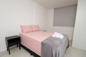 En eller flere senge i et værelse på Paraíso das águas, conforto e descanso com vista mar.. + 15 billeder