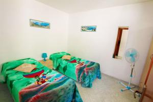 A bed or beds in a room at Appartamenti Leuca 50 m dal mare