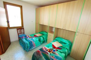 A bed or beds in a room at Appartamenti Leuca 50 m dal mare