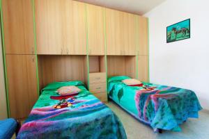 A bed or beds in a room at Appartamenti Leuca 50 m dal mare