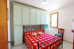 A bed or beds in a room at Appartamenti Leuca 50 m dal mare