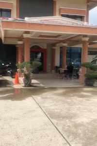 an orange cone in front of a building at Hotel Abna Sangatta Mitra RedDoorz in Sengata