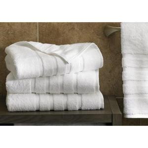 a stack of towels on a table in a bathroom at House 7 Mbora 2 Bedroom Luxury apartment A home away from home Jabi Near Wuse 2 Abuja Fully Serviced Wifi and More in Abuja