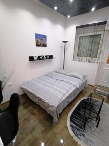 Katil atau katil-katil dalam bilik di Apartman Dejana