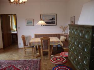 a dining room with a table and chairs at Haus Ilse in Bad Kleinkirchheim