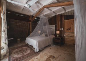 a bedroom with a bed and a canopy at El Valle Lodge in El Valle