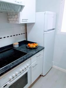 Kuchyň nebo kuchyňský kout v ubytování Apartamento El Príncipe