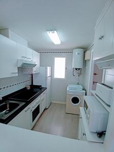 Kuchyň nebo kuchyňský kout v ubytování Apartamento El Príncipe
