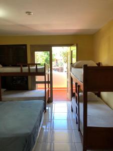 Ένα ή περισσότερα κρεβάτια σε δωμάτιο στο La Casa de Pedro Hostel