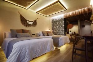 Postel nebo postele na pokoji v ubytování Xkan Hotel Boutique - Adults Only