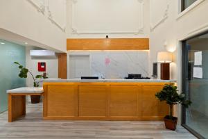 an office with a large wooden island in a room at Hotel Huntington in Duarte +110 photos