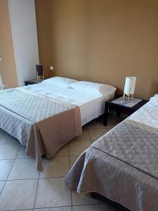 Postel nebo postele na pokoji v ubytování Il Faggio 17 B&B