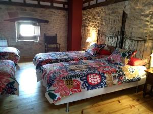 Llit o llits en una habitació de Don Baldomero Hotel Rural