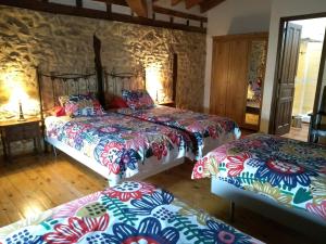 Llit o llits en una habitació de Don Baldomero Hotel Rural