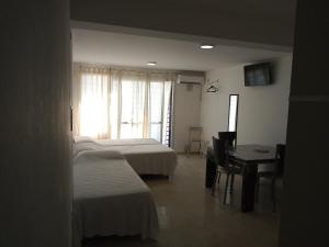 Ένα ή περισσότερα κρεβάτια σε δωμάτιο στο Moderno Microcentro - Apartamentos Céntricos V