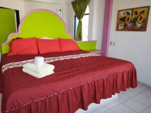 Postel nebo postele na pokoji v ubytování Hotel Real del Quijote a sólo 50 metros de la playa