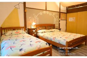 Letto o letti in una camera di Here Sleep Guesthouse