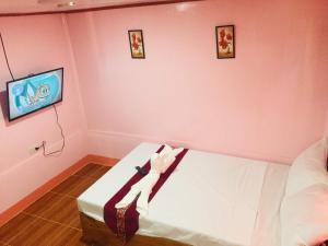 Postel nebo postele na pokoji v ubytování JayDin Travellers Inn