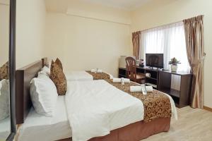 TV a/nebo společenská místnost v ubytování RJ Hotel Kulai