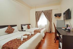 TV a/nebo společenská místnost v ubytování RJ Hotel Kulai