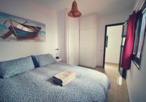 Postel nebo postele na pokoji v ubytování Casita de la Playa, La Aldea de San Nicolás