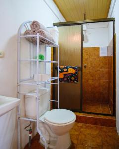 a bathroom with a toilet and a shower at Casa Cattleya - Monteverde, Costa Rica in Monteverde Costa Rica