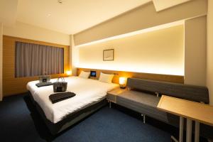 Ένα ή περισσότερα κρεβάτια σε δωμάτιο στο AMANEK Beppu YULAｰRE
