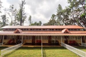 a large building with a lot of windows at Citadel Resort in Panchgani