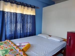 Кровать или кровати в номере Red Rock Arambol Beach